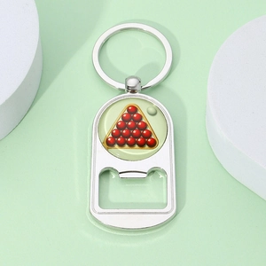 Close-up of silver metal sports keychain featuring a billiard ball design and bottle opener