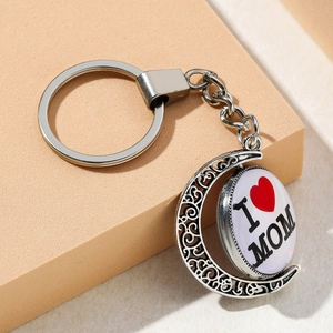 Rotating silver moon keychain with I Love Mom heart design and vintage hollow engraving