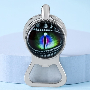Macro shot of metal dragon eye bottle opener keychain showing vibrant iris and glass dome