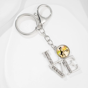 Silver cat gem pendant keychain with LOVE rhinestones and tennis cat illustration