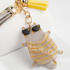 Creative gray cat keychain with sunglasses, gold chain, and vibrant yellow tassel