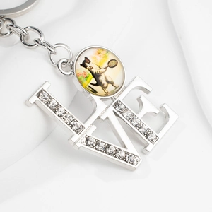 Silver LOVE keychain with sparkling rhinestones and a funny cartoon dog tennis charm