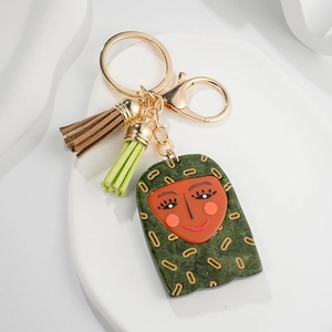 Abstract green marble face keychain with double tassels and gold lobster clasp detail