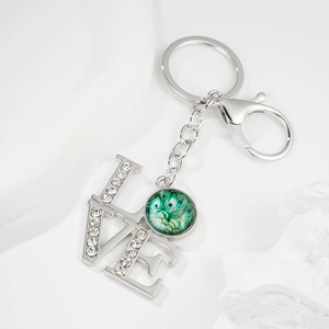 Sparkling LOVE rhinestone keychain with peacock feather pattern and silver lobster clasp