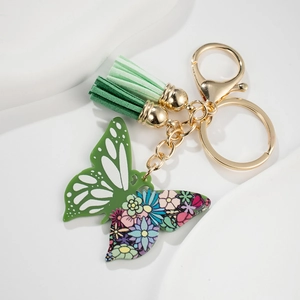 Detailansicht Schmetterling-Schlüsselanhänger mit Blumenmuster und Doppelquasten
