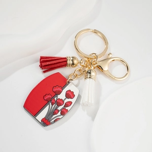 Porte-clés fleuri de style européen avec pompons bicolores et anneau doré poli