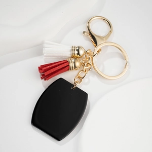 Porte-clés de style européen avec pendentif noir, glands colorés et quincaillerie dorée