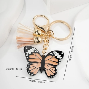 Exquisite butterfly keychain with colorful wings and tassels in a stylish gold finish