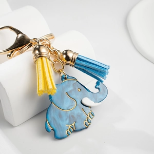 Cute gold-plated elephant keychain with blue marble pattern and colorful tassels