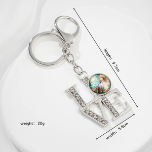 Detailed size view of silver LOVE keychain with rhinestones and lobster clasp