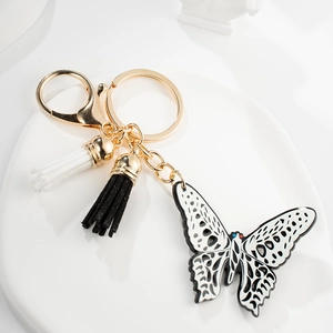Fashion Hollow Butterfly Pendant Keychain With Black And White Tassels Gold Metal Key Ring Bag Charm For Women Jewelry