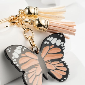Fashionable butterfly keychain with colorful wings and elegant suede tassels for handbags