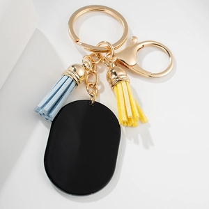 European butterfly style keychain with blue and yellow tassels and oval pendant