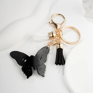 Fashion hollow butterfly keychain with black and white tassels and gold metal clip