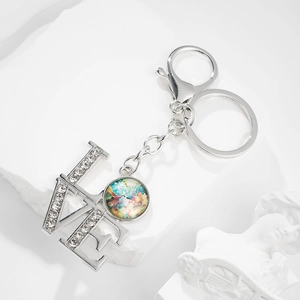 Artistic silver LOVE keychain with hummingbird gemstone pendant and sparkling rhinestones