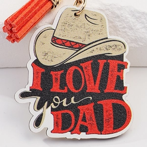Portachiavi cappello da cowboy con scritta I LOVE YOU DAD e nappina arancione vivace