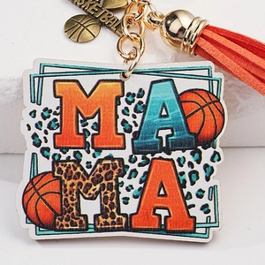 Mama keychain with orange tassel, basketball charm, and printed patterned lettering
