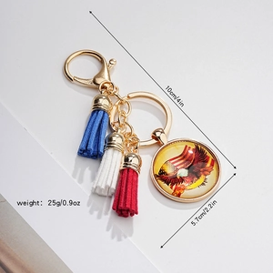Detailed size specs for eagle keychain with patriotic glass charm and leather tassel