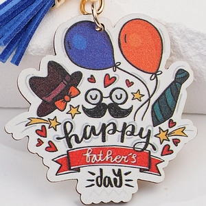 Happy Father's Day keychain with hat mustache graphics and a dark blue tassel