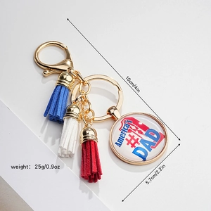 Detail view of patriotic American eagle keychain with colorful fringe and #1 DAD pendant