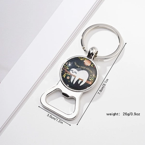 Detail of sloth bottle opener keychain with Follow Your Dreams text and size specs