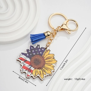 Détail du porte-clés tournesol patriotique avec drapeau américain et pompon bleu