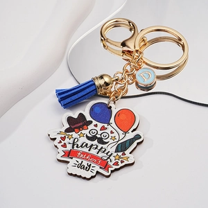 Detailed view of Father's Day keychain with blue tassel and mirror reflection display
