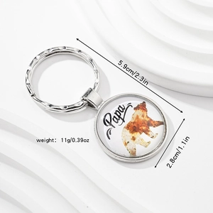 Detail view of Papa bear metal keychain with dimensions 5.9cm and 2.8cm diameter