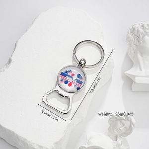 Detail of silver bottle opener keychain with President's Day theme on white stone