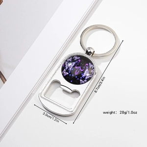Detail view of silver bottle opener keychain with a purple butterfly glass dome and M letter