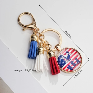 Detailed close-up of eagle USA flag glass cabochon with red white and blue tassels
