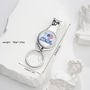 Detailed view of silver nail clipper keychain with American flag heart and size dimensions