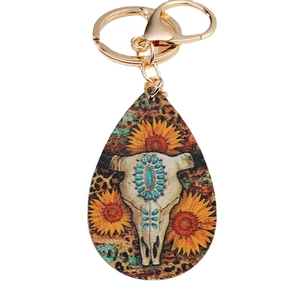 Bohemian bull skull keychain with sunflower and leopard print on a golden pendant