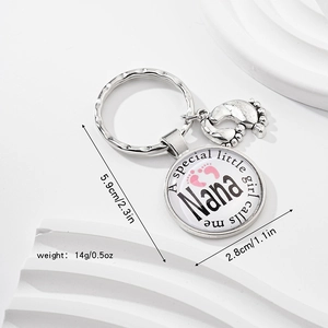 Detailed silver baby footprint keychain with engraved charm for a special little girl