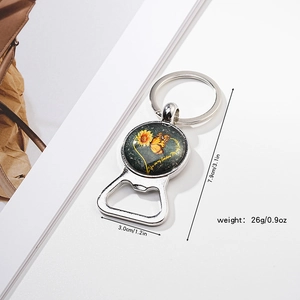 Detail of sunflower bottle opener keychain with You Are My Sunshine glass dome decoration