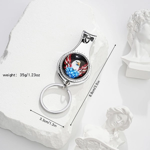 Macro shot of multifunctional nail clipper keychain featuring American flag and eagle design