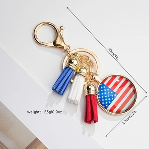 Close-up of patriotic American flag pendant with red white and blue leather tassels