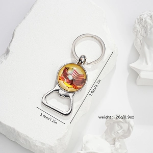 Detail of metal eagle flag keychain with bottle opener on decorative white stone