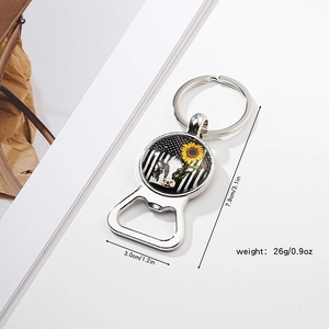 Macro detail of sunflower bottle opener keychain with size and weight dimensions
