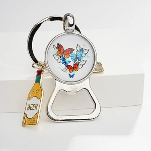 Macro view of a silver metal bottle opener keychain with colorful butterfly heart art
