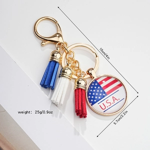 Detail view of American eagle tassel keychain with U.S.A. pattern glass pendant