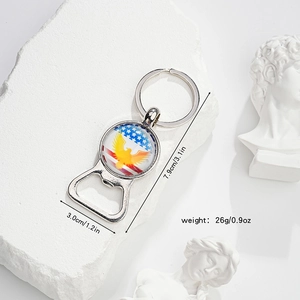 Silver metal American flag eagle bottle opener keychain with glass gem on marble stone