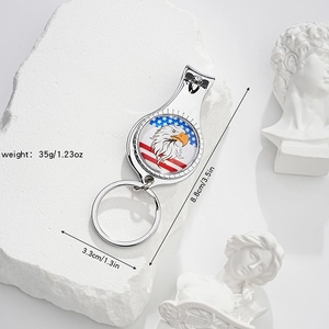 Detailed view of 3.5-inch eagle flag nail clipper keychain with dimensions on stone