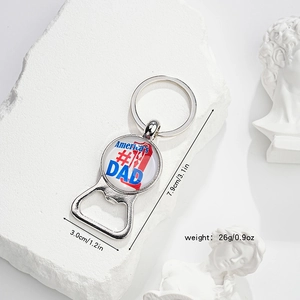 Detail of metal bottle opener keychain with America's #1 DAD glass dome design