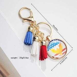 Close-up of eagle flag glass keychain with red white blue tassels and size markings