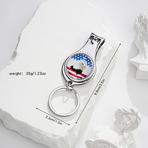 Macro view of nail clipper keychain with American flag eagle design and size dimensions