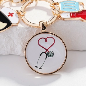 Détails du porte-clés infirmière avec stéthoscope et masque en métal doré brillant