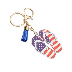 Porte-clés créatif tongs drapeau américain avec pompon bleu et matériel doré