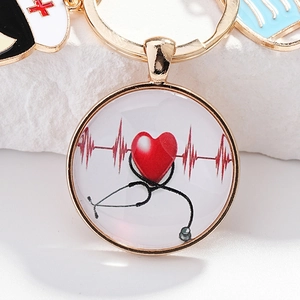 Porte-clés médical doré avec stéthoscope et motif rythme cardiaque pour infirmières et médecins