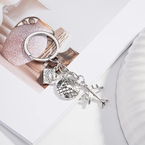 Silver world map travel keychain with vintage airplane, suitcase and globe charms